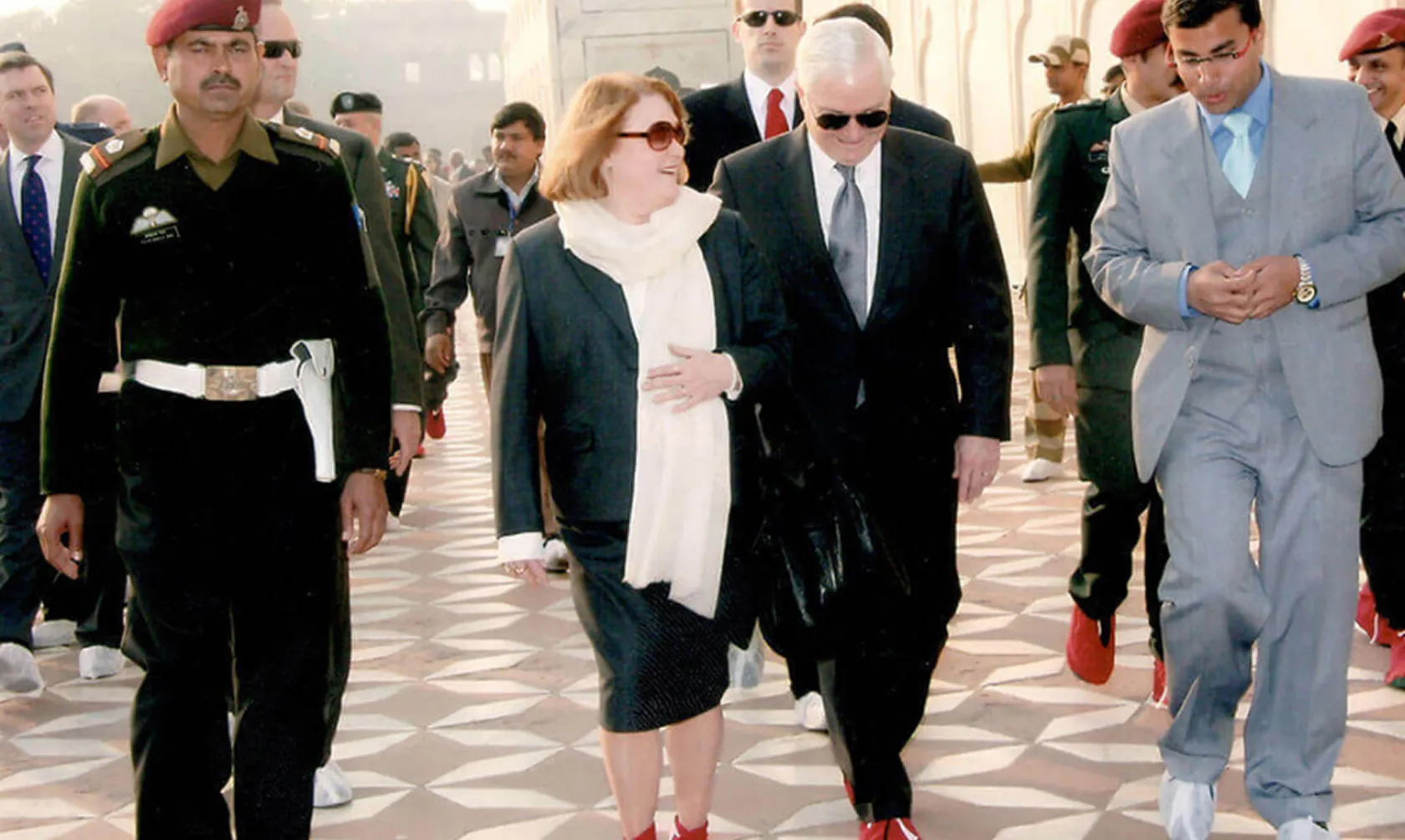 Robert M. Gates former USA defence secretary and his convoy walking with Travelosei team member