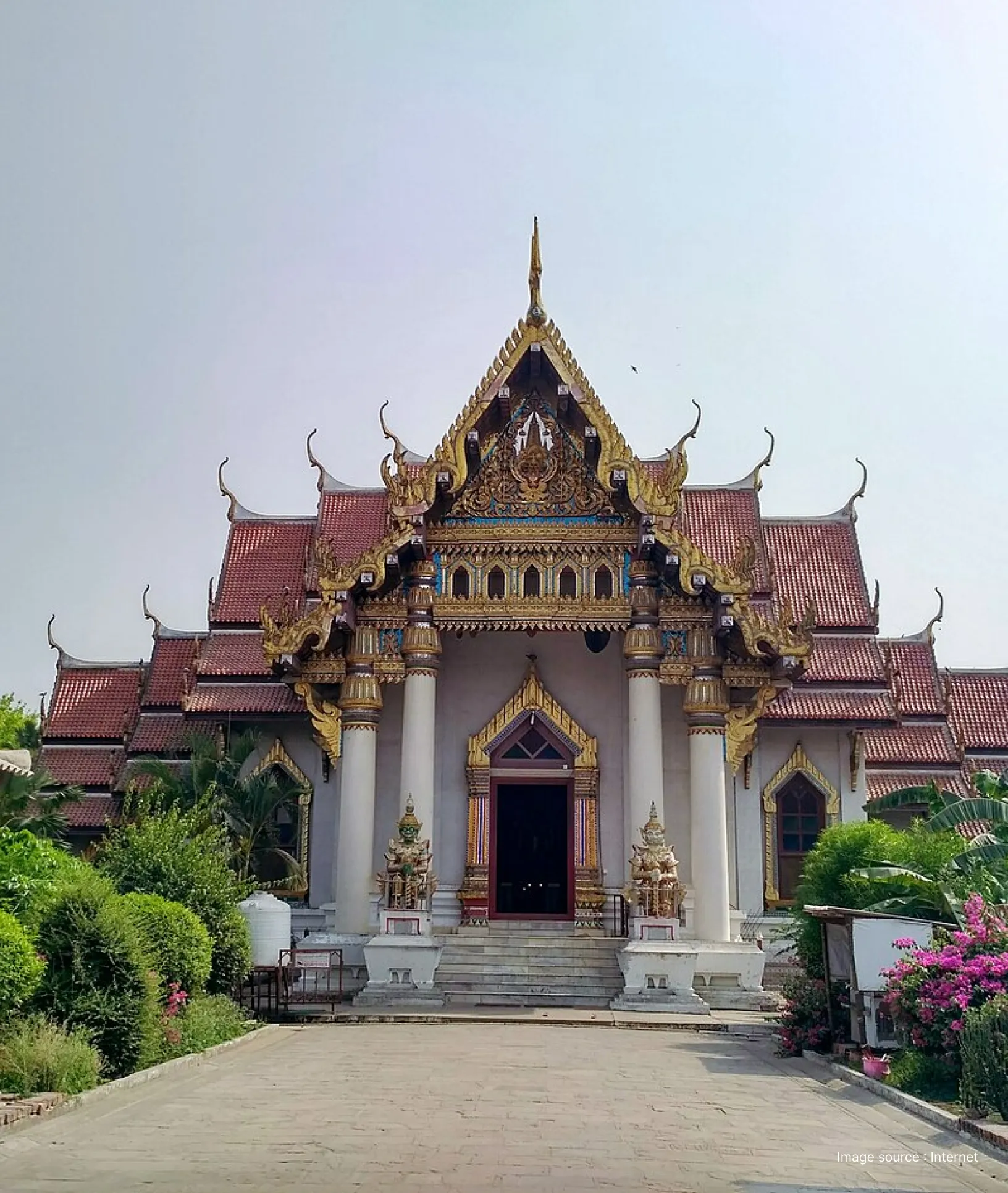 Thai Theravada Buddhist Monastery in Bodh Gaya with ornate golden roof and traditional Thai design