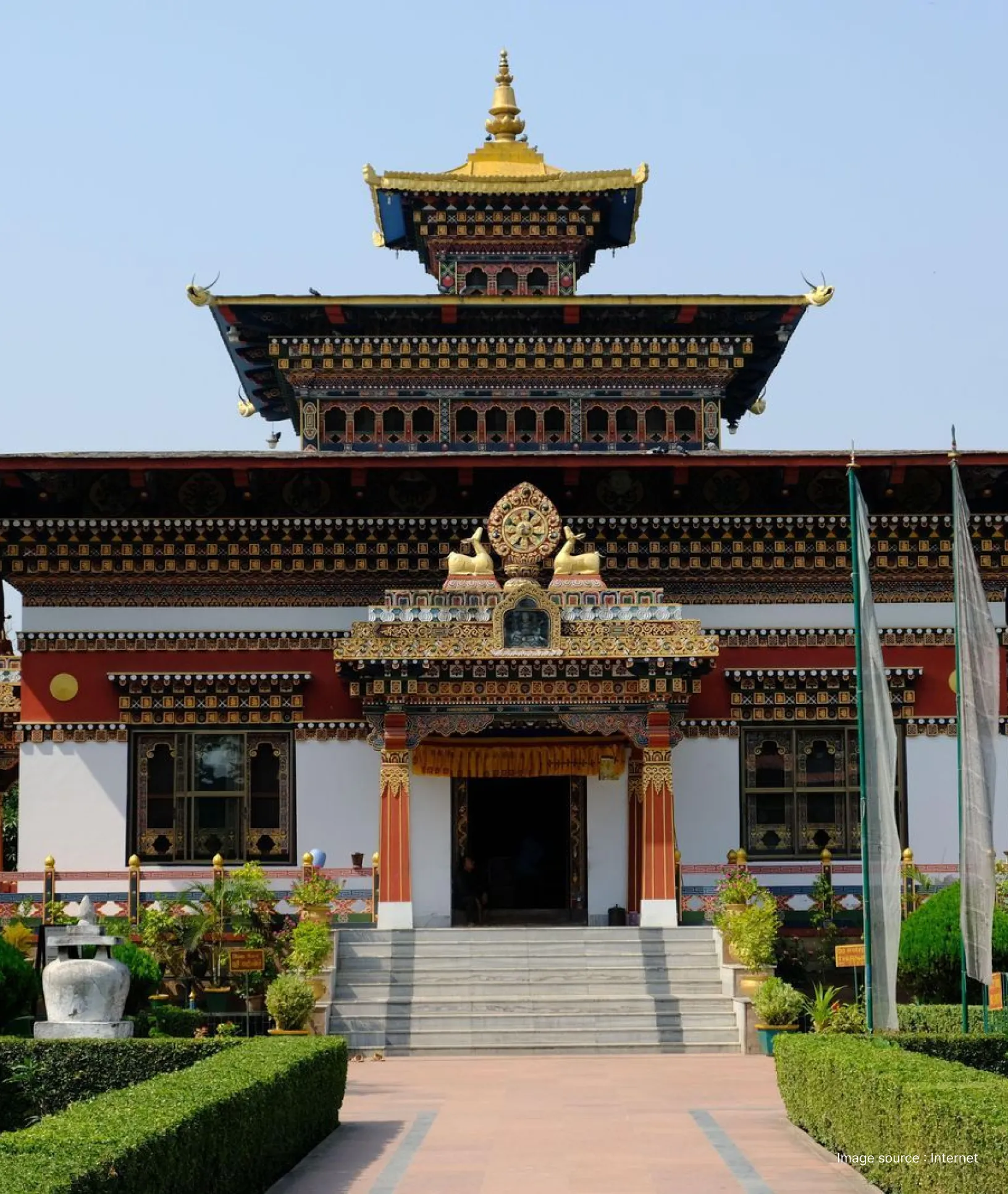 Royal Bhutanese Monastery in Bodh Gaya featuring Bhutanese Buddhist architecture and vibrant detailing