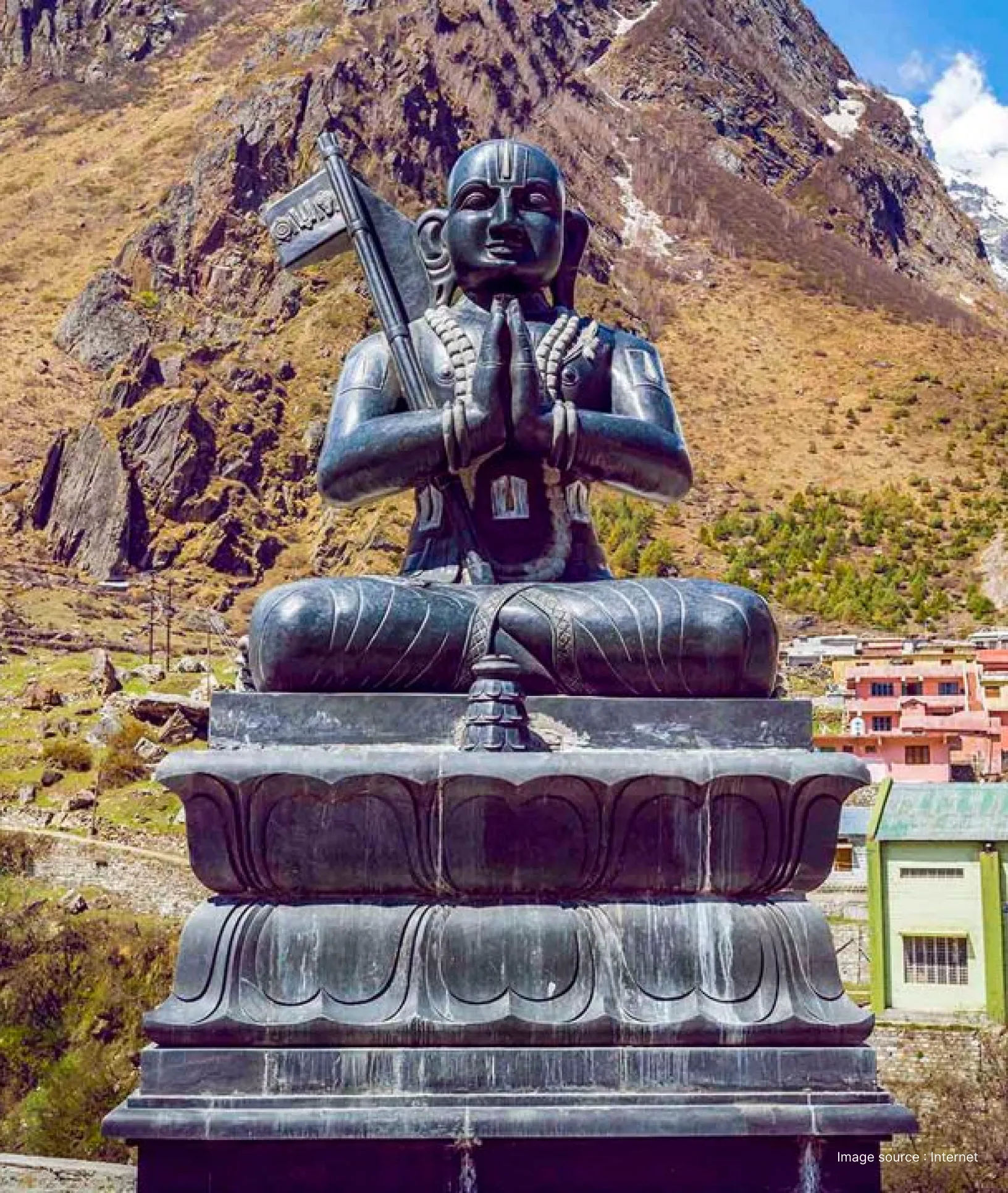 Adi Shankaracharya statue near Badrinath Temple in Uttarakhand, depicting the revered philosopher seated in meditation against the Himalayan mountain backdrop