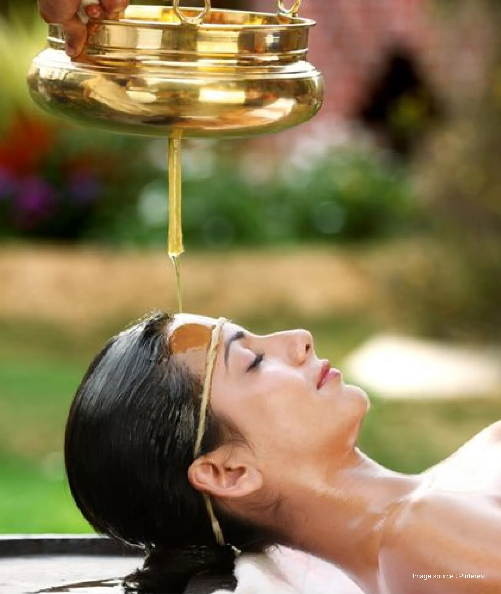 a woman enjoying a traditional ayurveda therapy in an wellness retreat