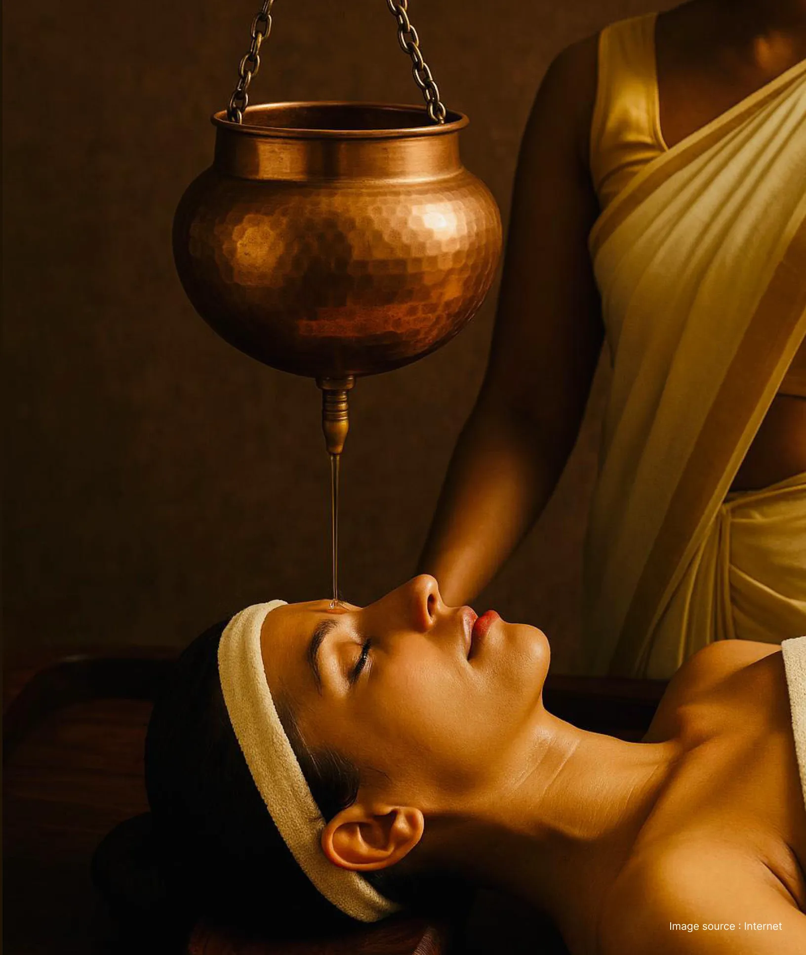 A woman enjoying traditional oil based healing therapy in an ayurveda retreat