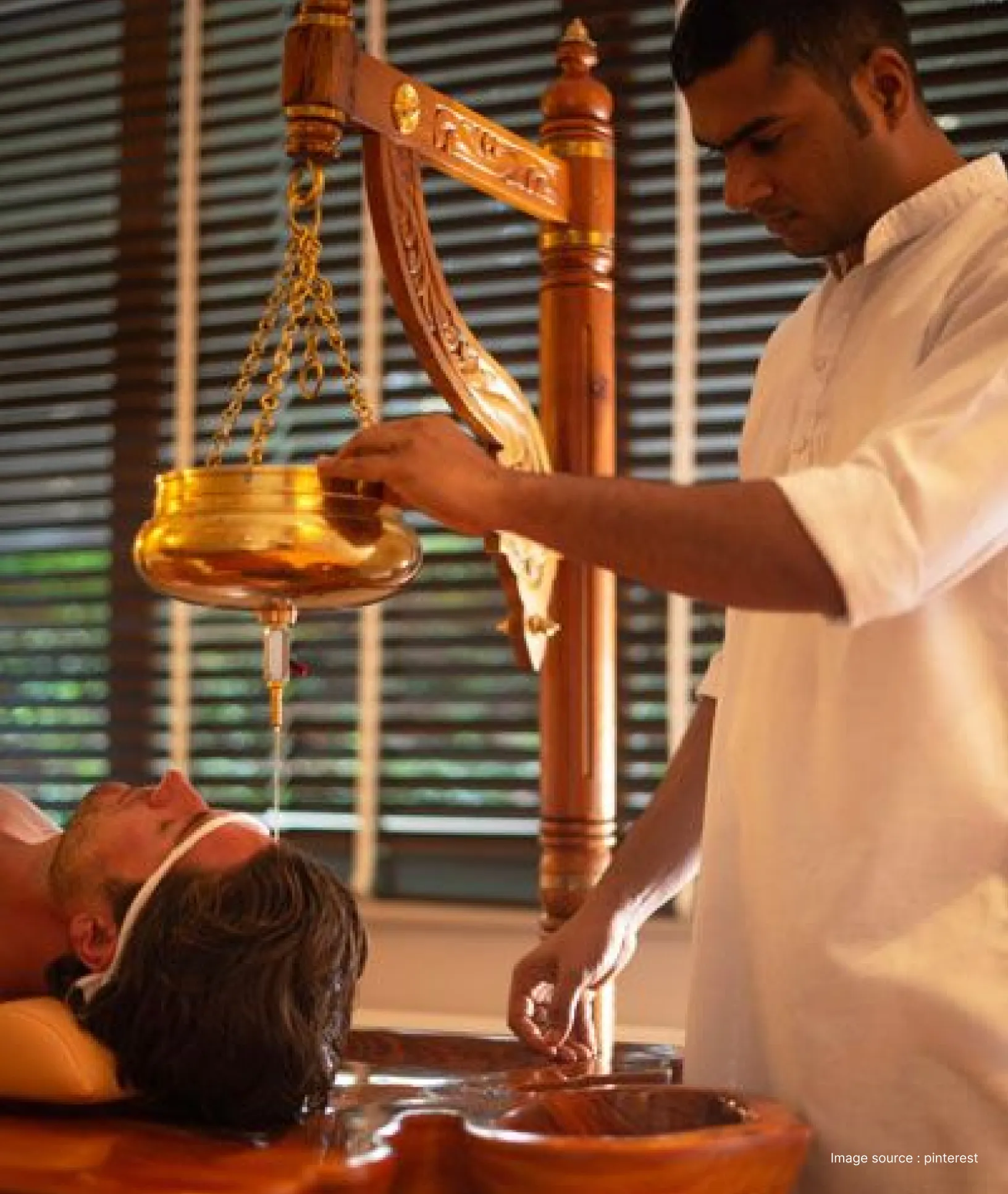 a man performing traditional oil based ayurvedic healing therapy on another man