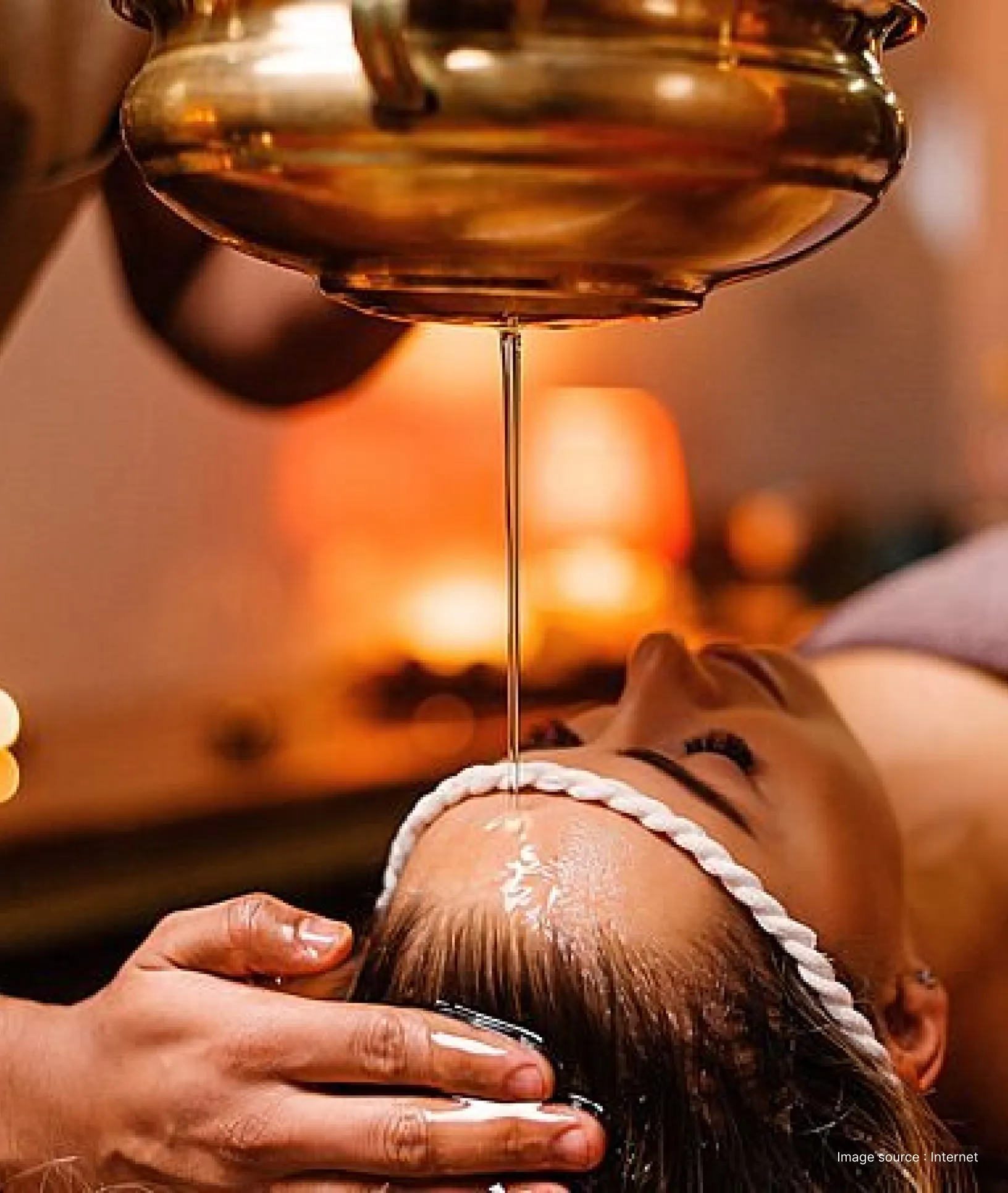 A woman enjoying traditional ayurvedic oil based therapy