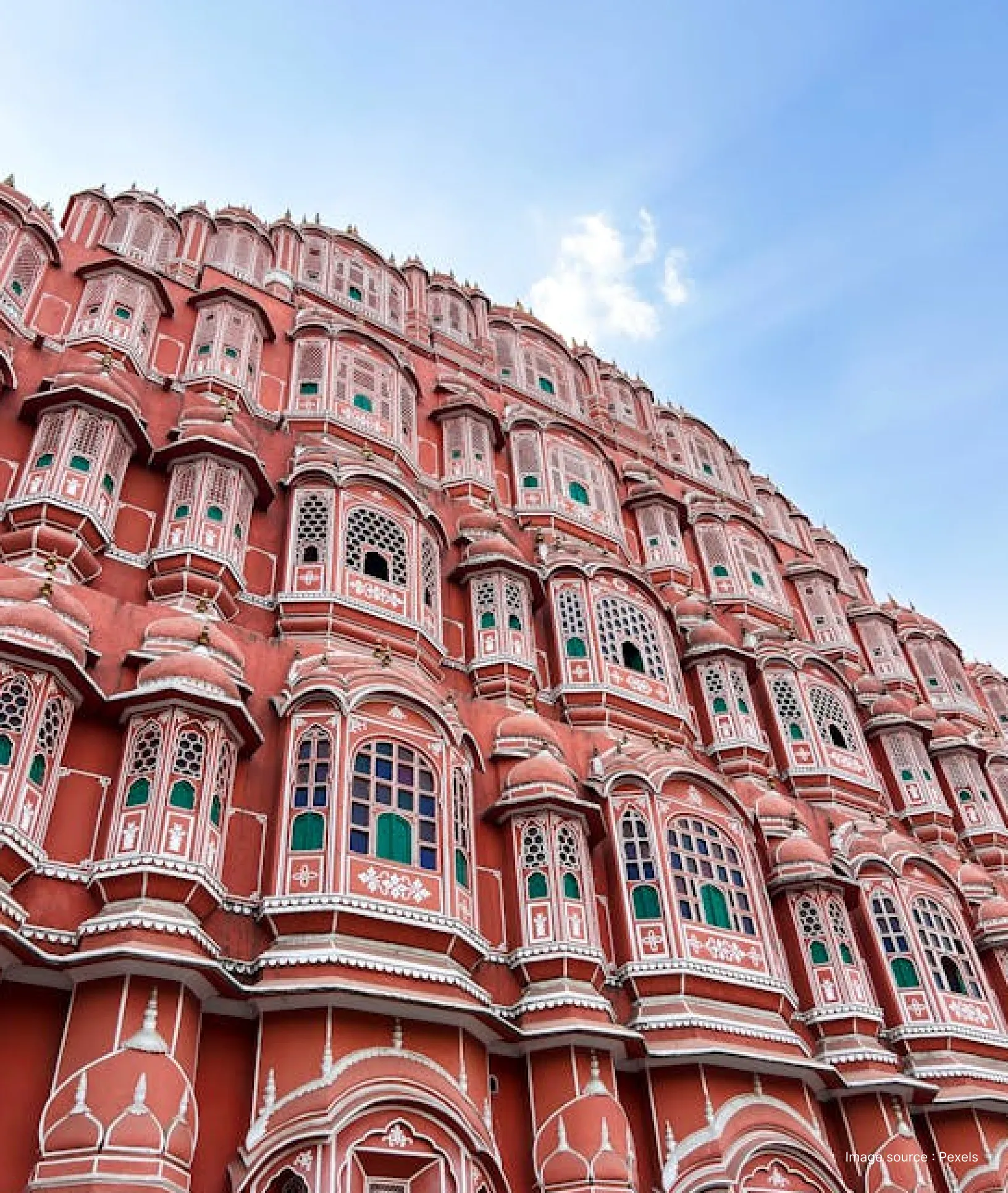 a unique view from the bottom of the opulent hawa mahal during the day