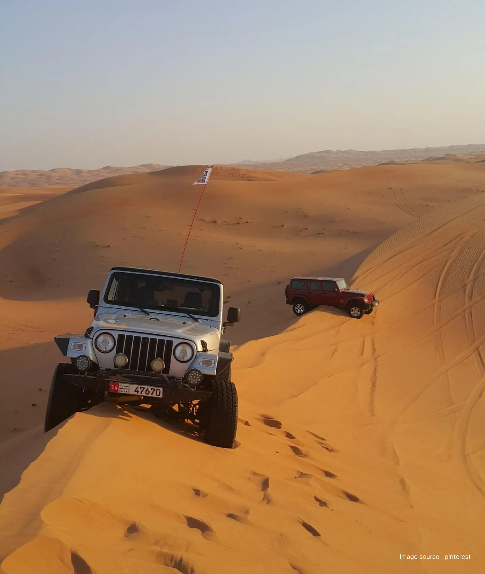 dune bashing in jaisalmer with a jeep riding the peaks at sunset