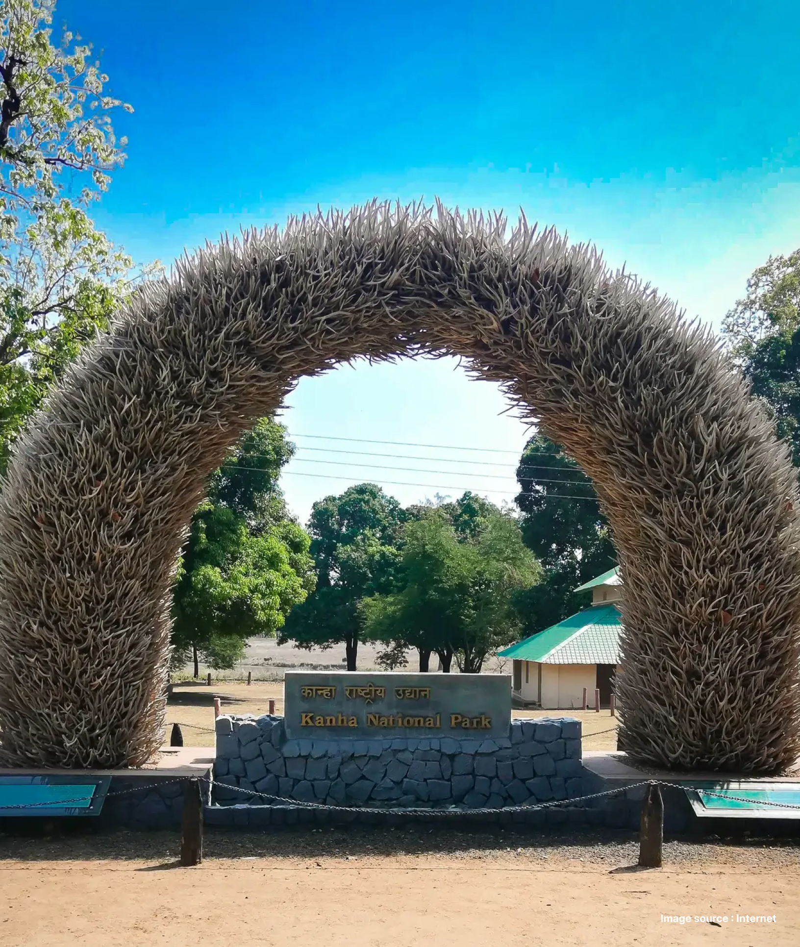 entrance gate of the Kanha national park with a decorated archway of plants