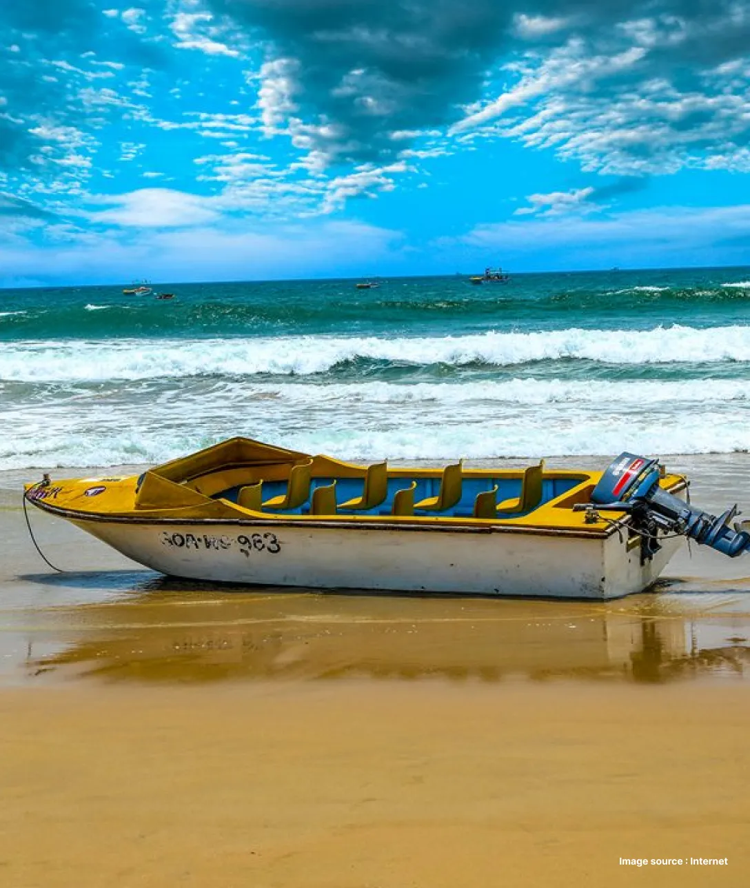 a white boat parked by the coast in goa on a cloudy day