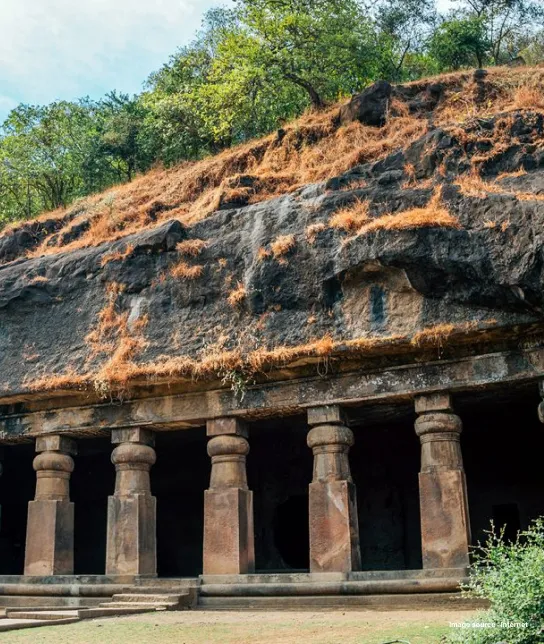 an image of a hut like structure with pillars running through them