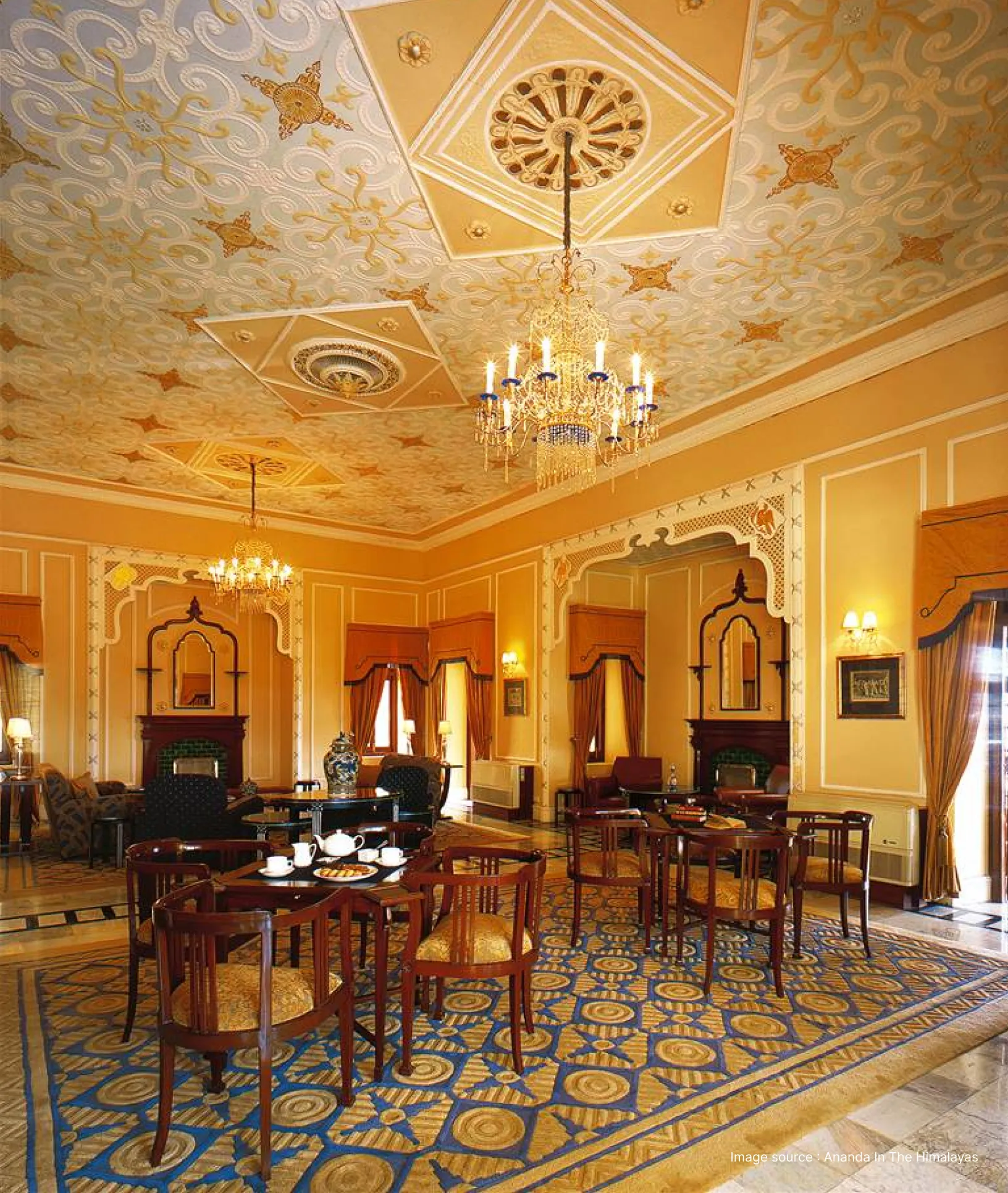 royal interiors with painted ceilings and wooden seating at ananda resort