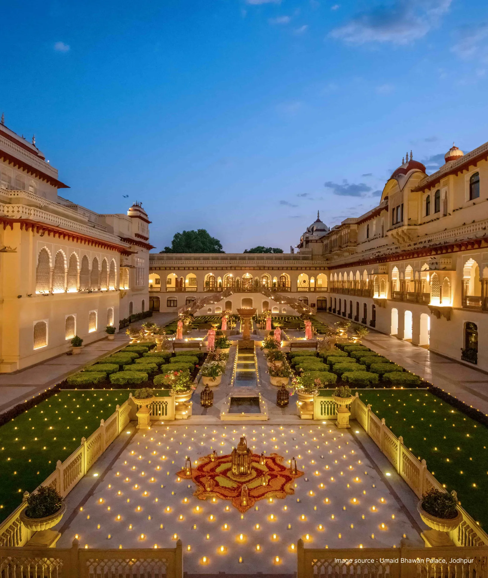 lit-up garden at dush of the taj rambagh palace