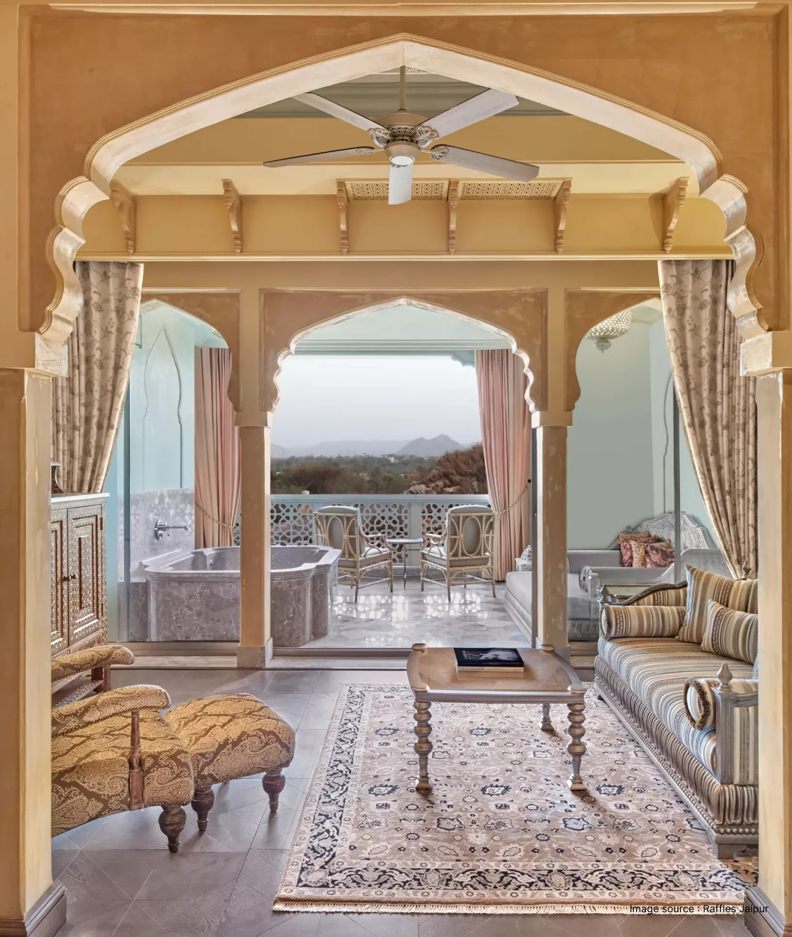inside view of a royal suite of the raffles jaipur hotel with detailed archways and royal interiors