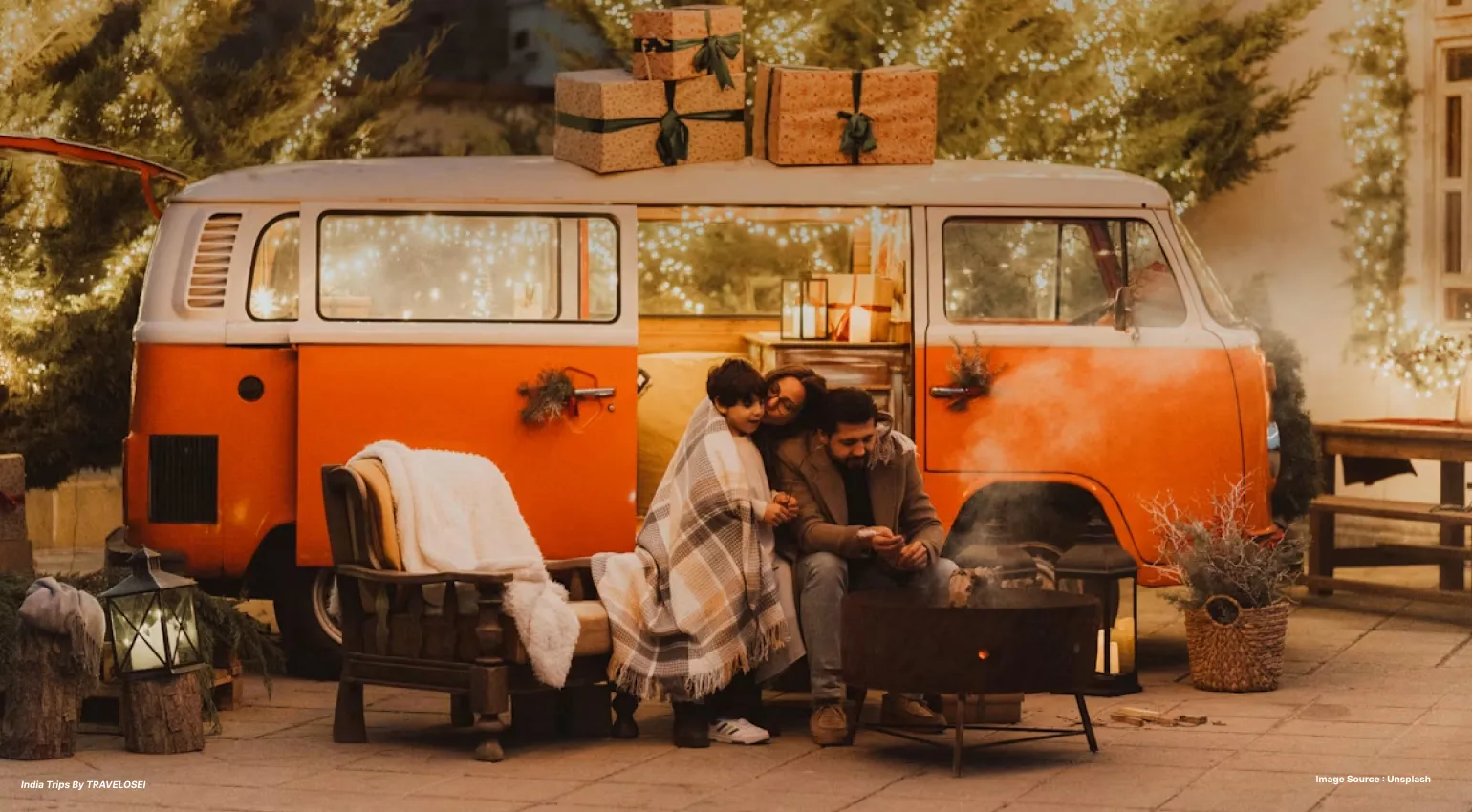 An image of a family enjoying camping with a campervan