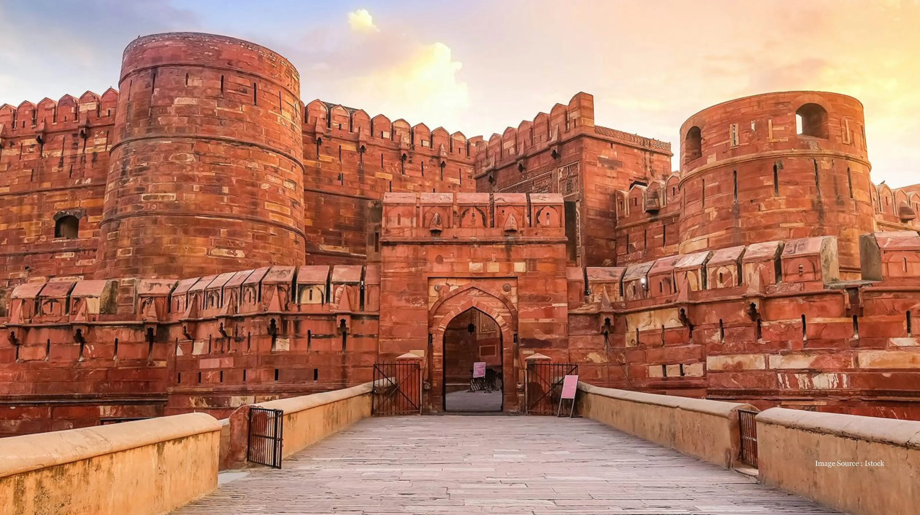 traveller tours Agra Fort red sandstone gateway at sunset
