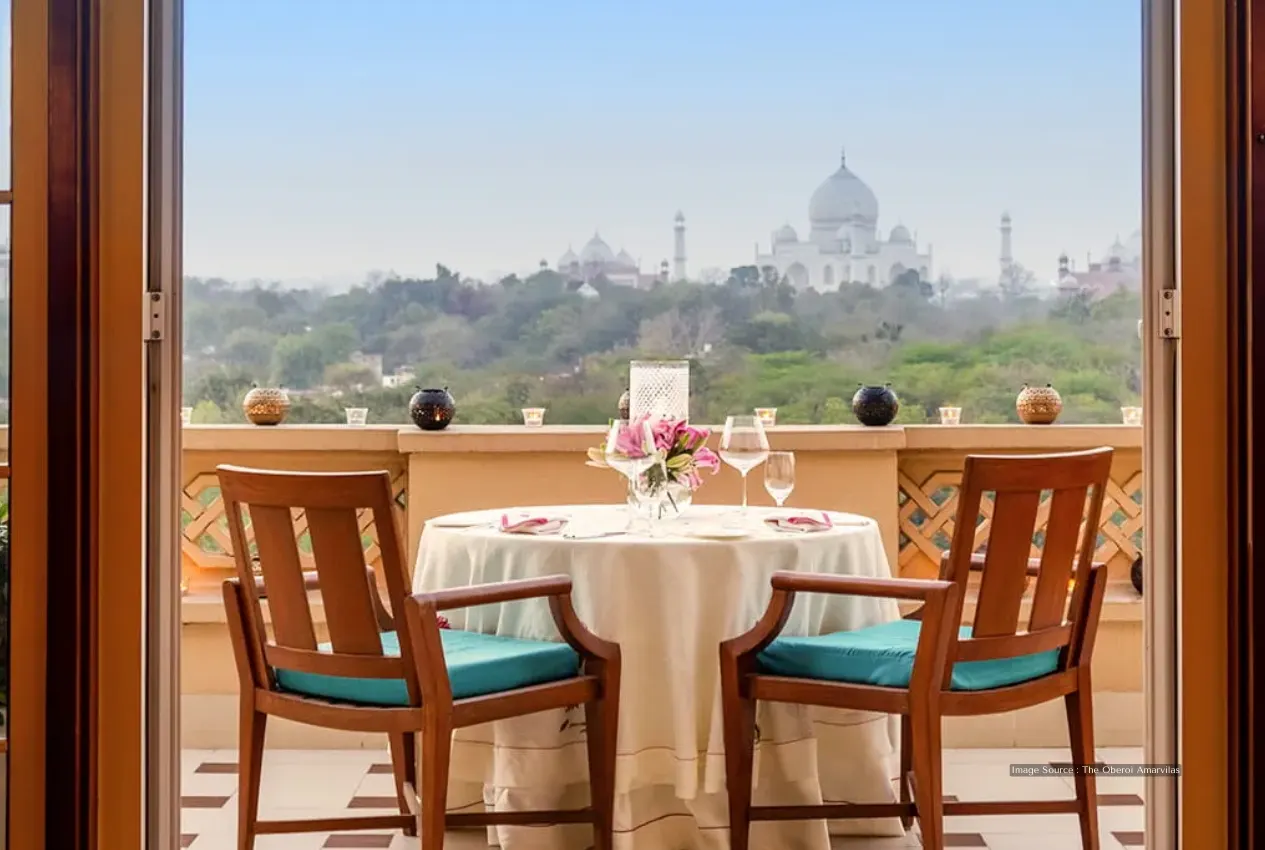 Romantic dining setup with a stunning Taj Mahal view, perfect for a memorable Agra tour experience.