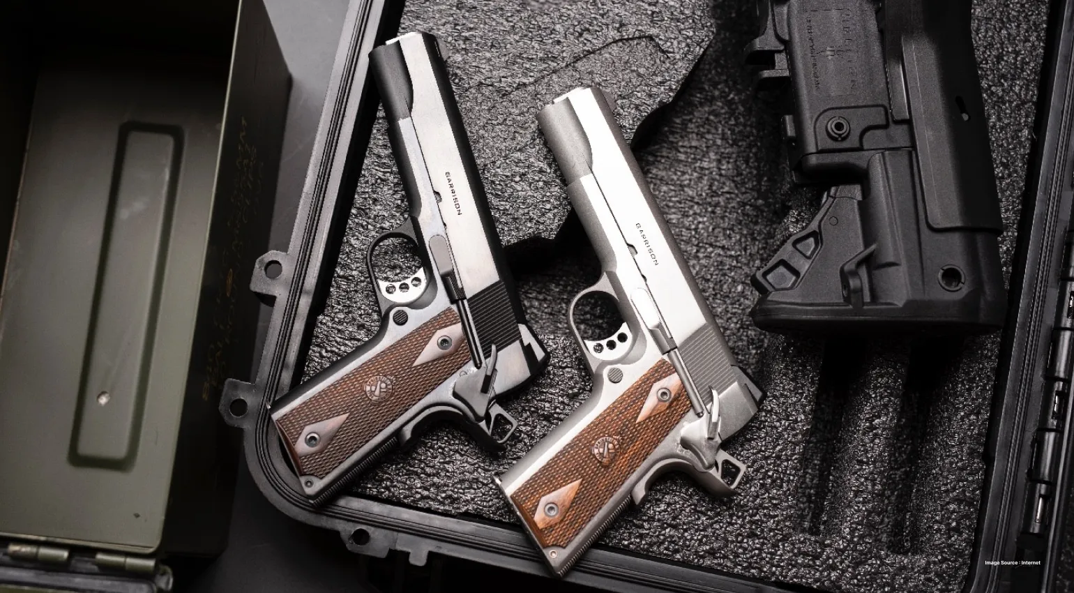 two silver guns kept in a black case