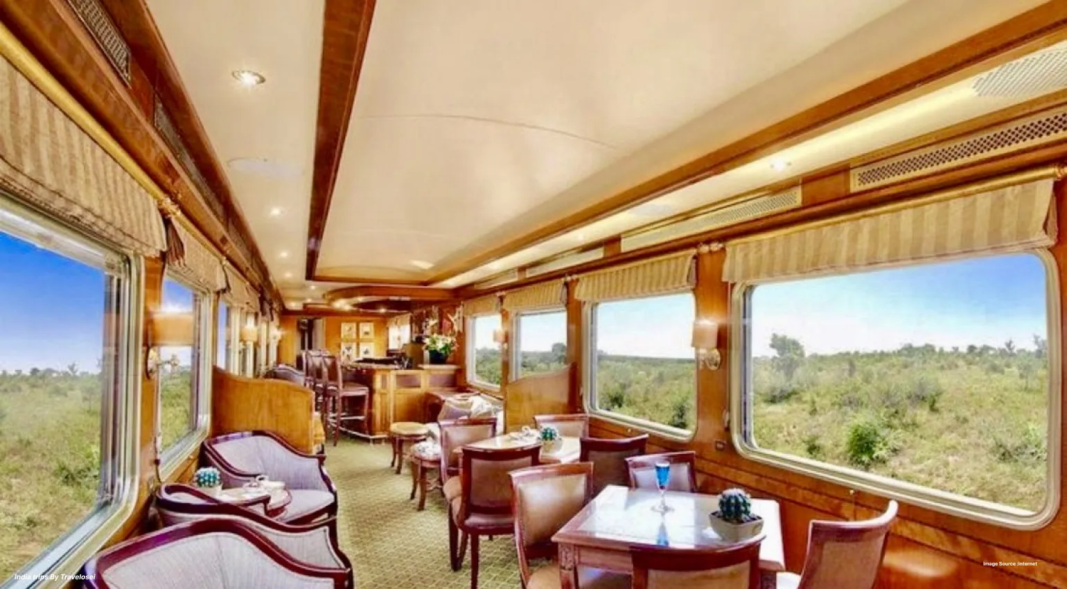 Elegant luxury train lounge with panoramic countryside views.