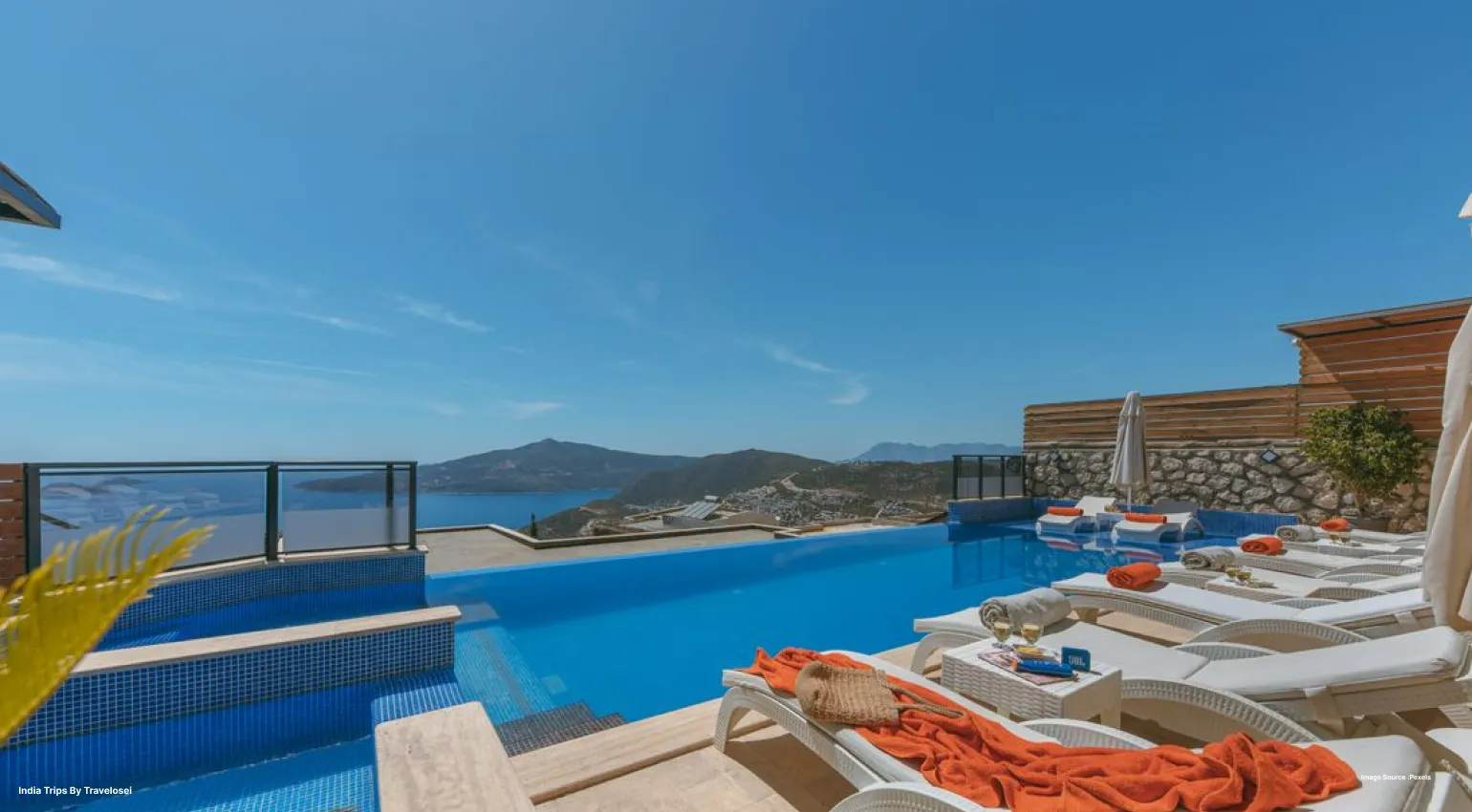Infinity pool overlooking the ocean at a luxury resort.