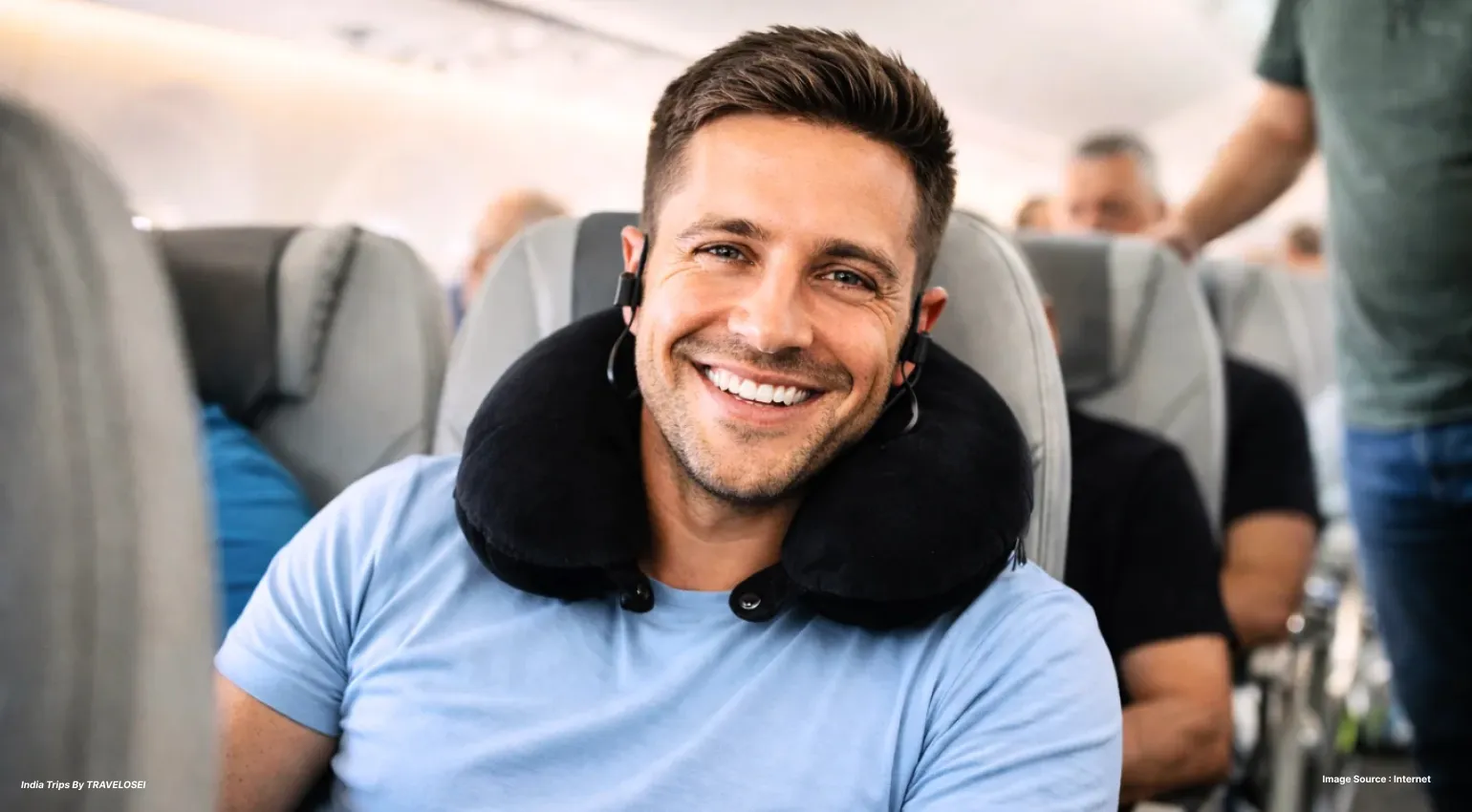 A man with a neck pillow around his neck sitting on an airplane seat
