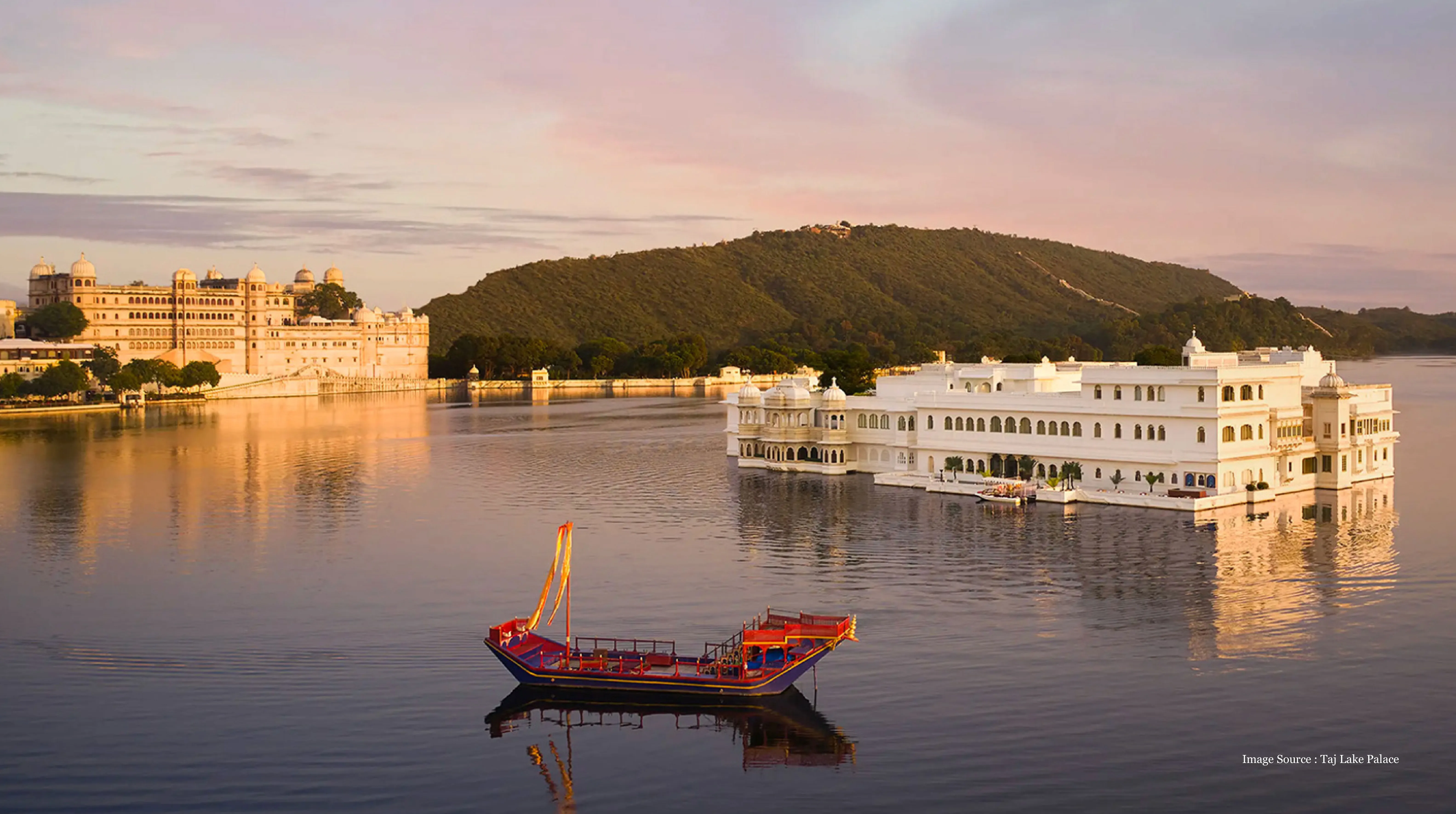 Scenic view of Taj Lake Palace, a famous heritage place surrounded by water and hills in Udaipur, Rajasthan