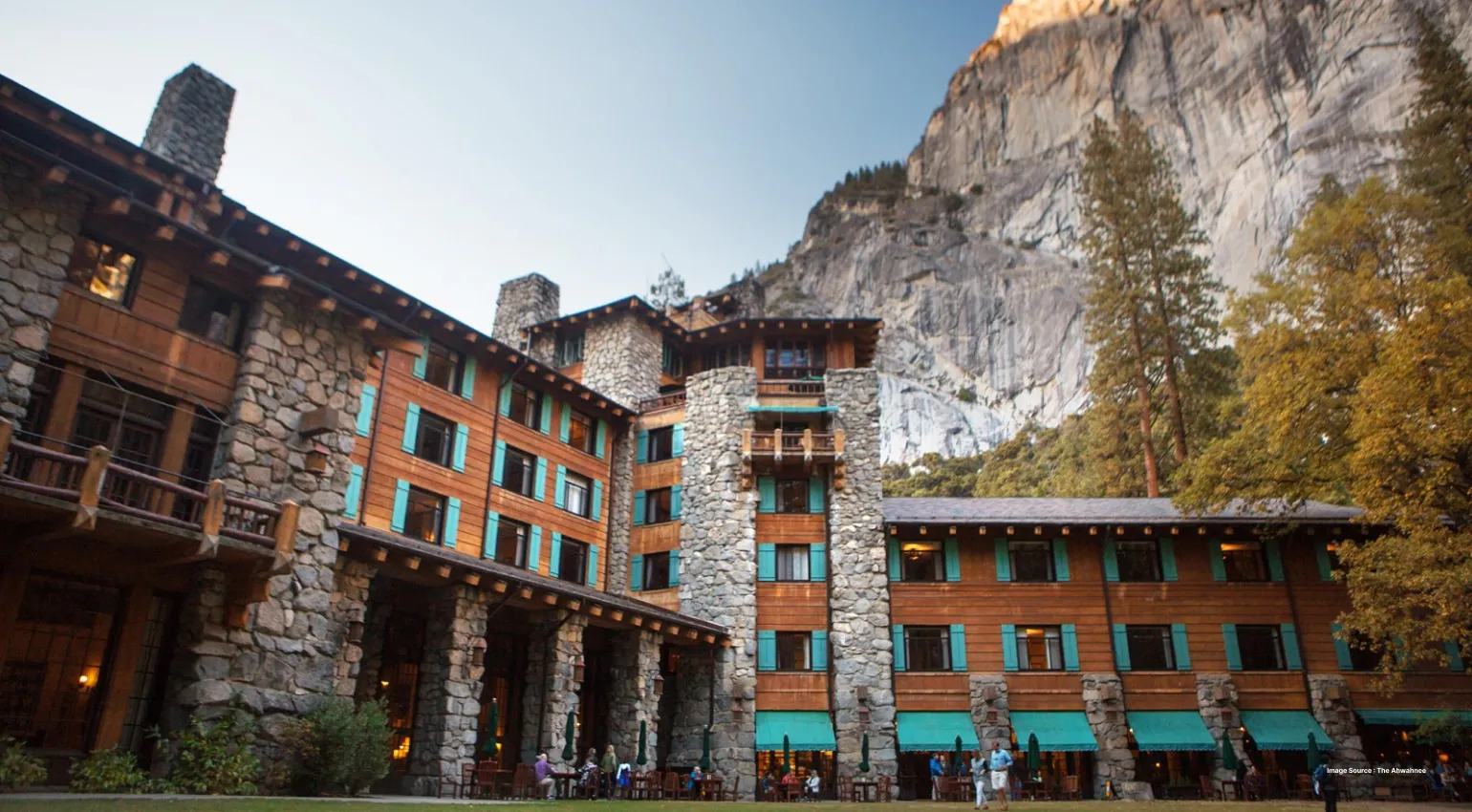 the ahwanee hotel's ancient architecture beside a big rocky cliff