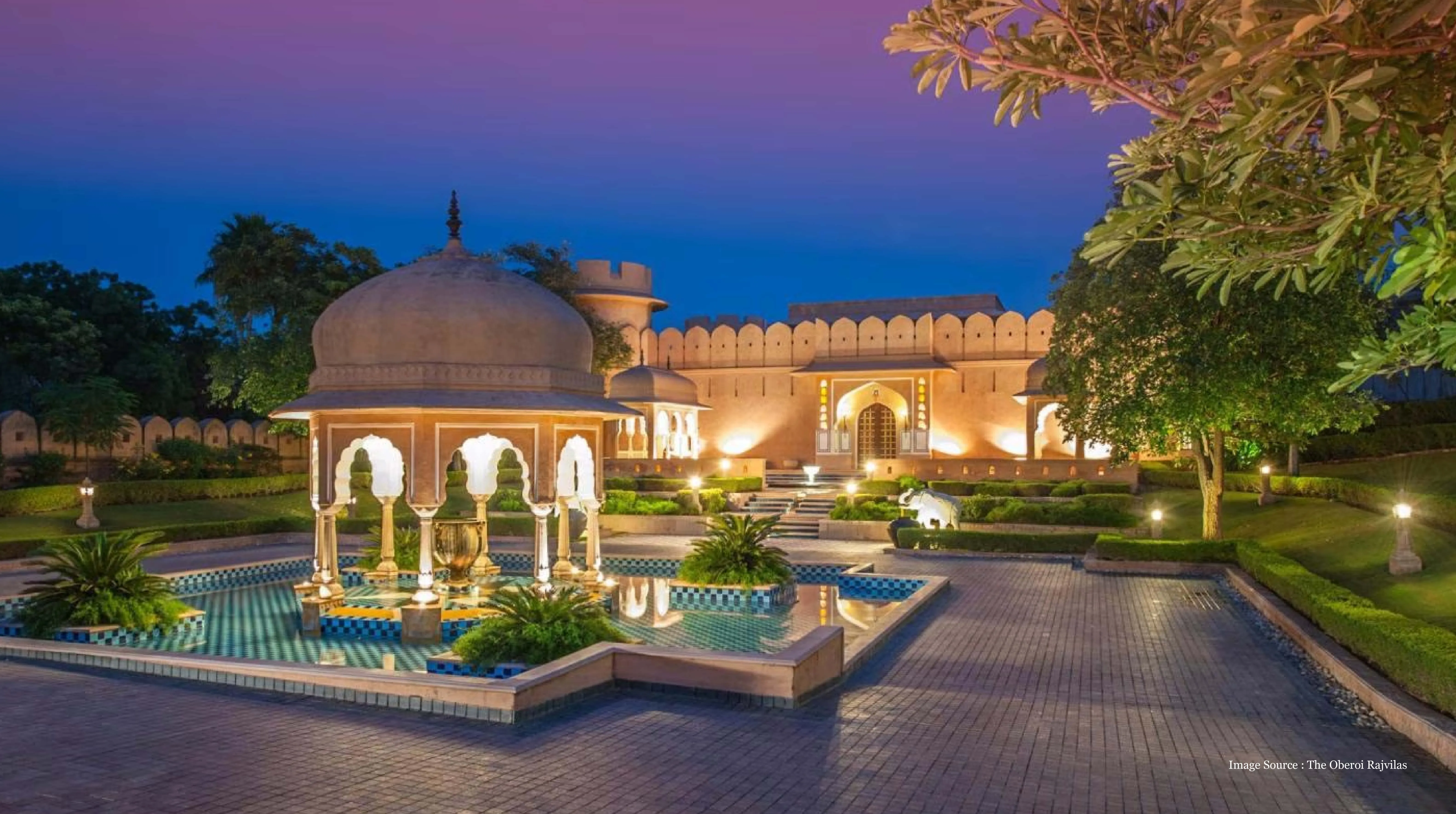 rajasthan vs kerala luxury trip: Illuminated palace courtyard at Oberoi Rajvilas in Rajasthan, perfect for luxury travel comparison.