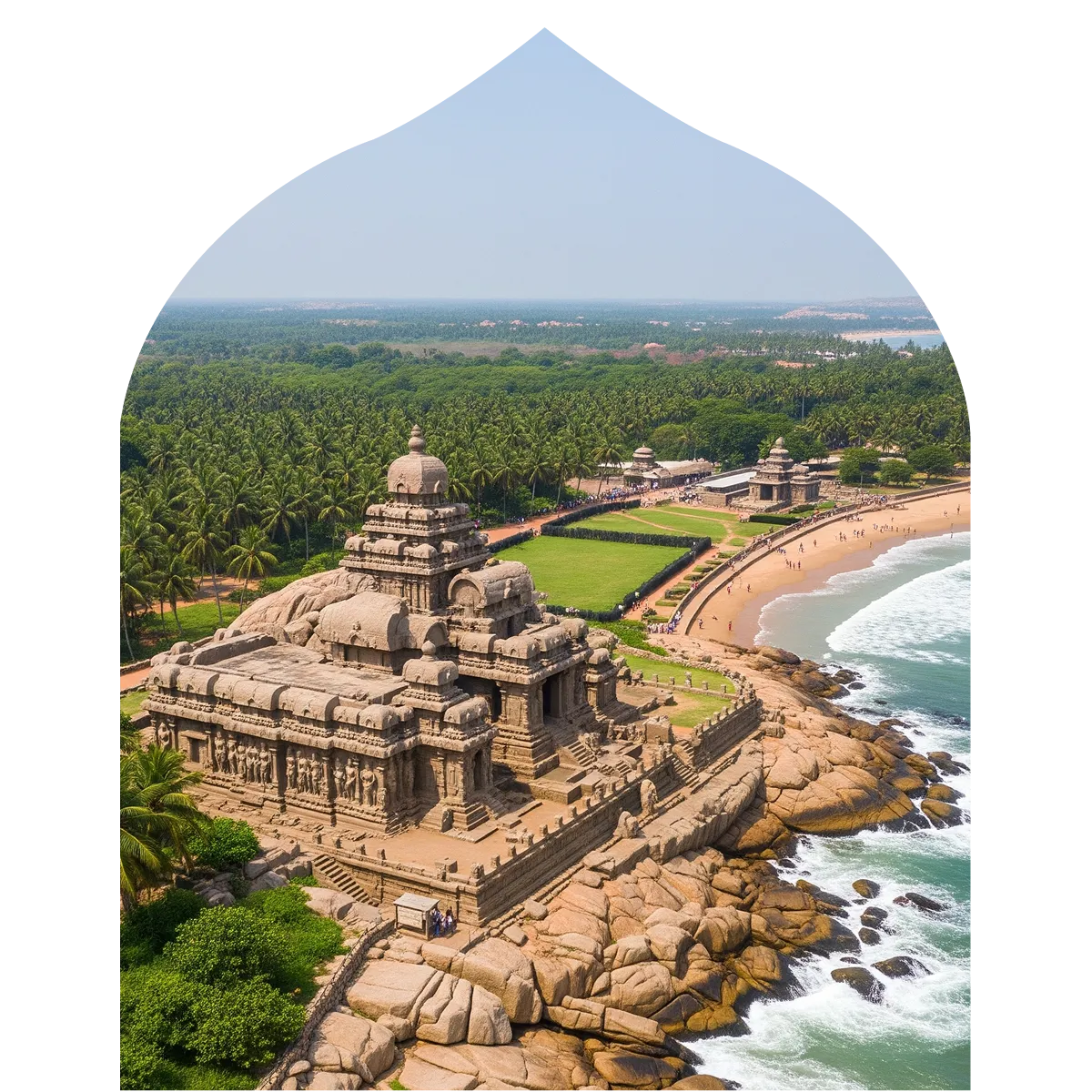 an aerial shot of mahabalipuram's beach with the shore temple and green trees in view