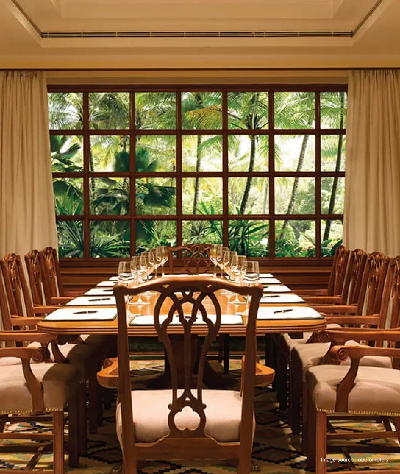 wooden furniture set up for a meeting at a hotel