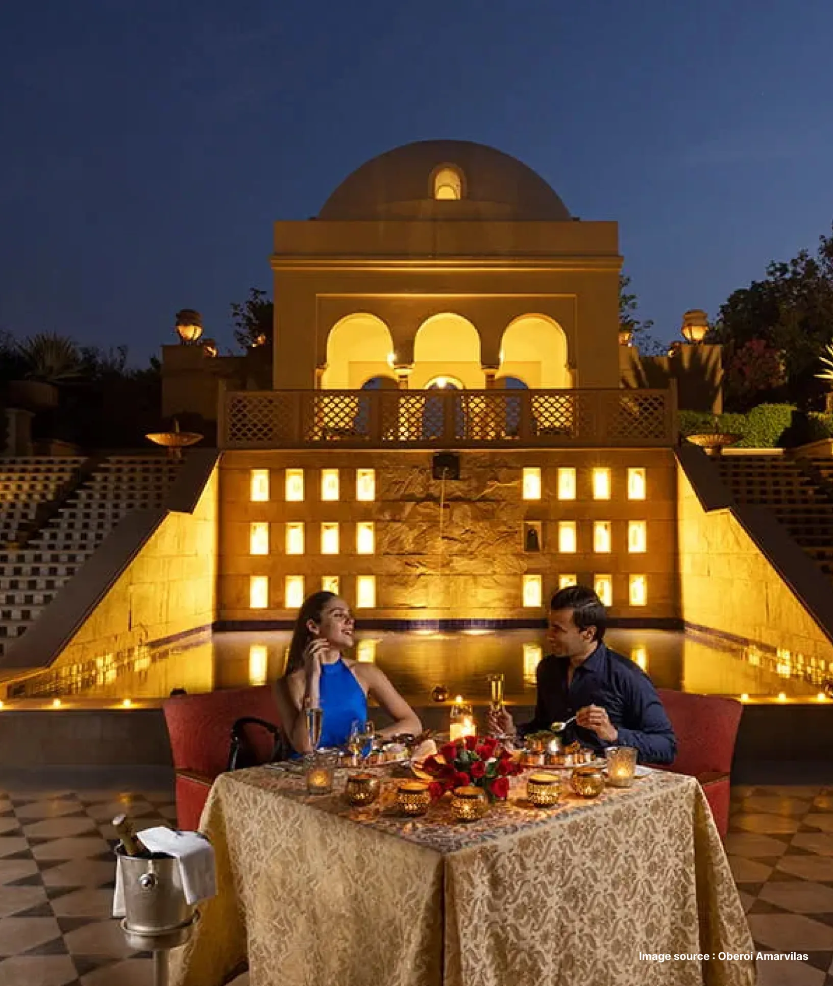 a dome style archway background lit up in the evening for a couple's romantic gourmet dinner