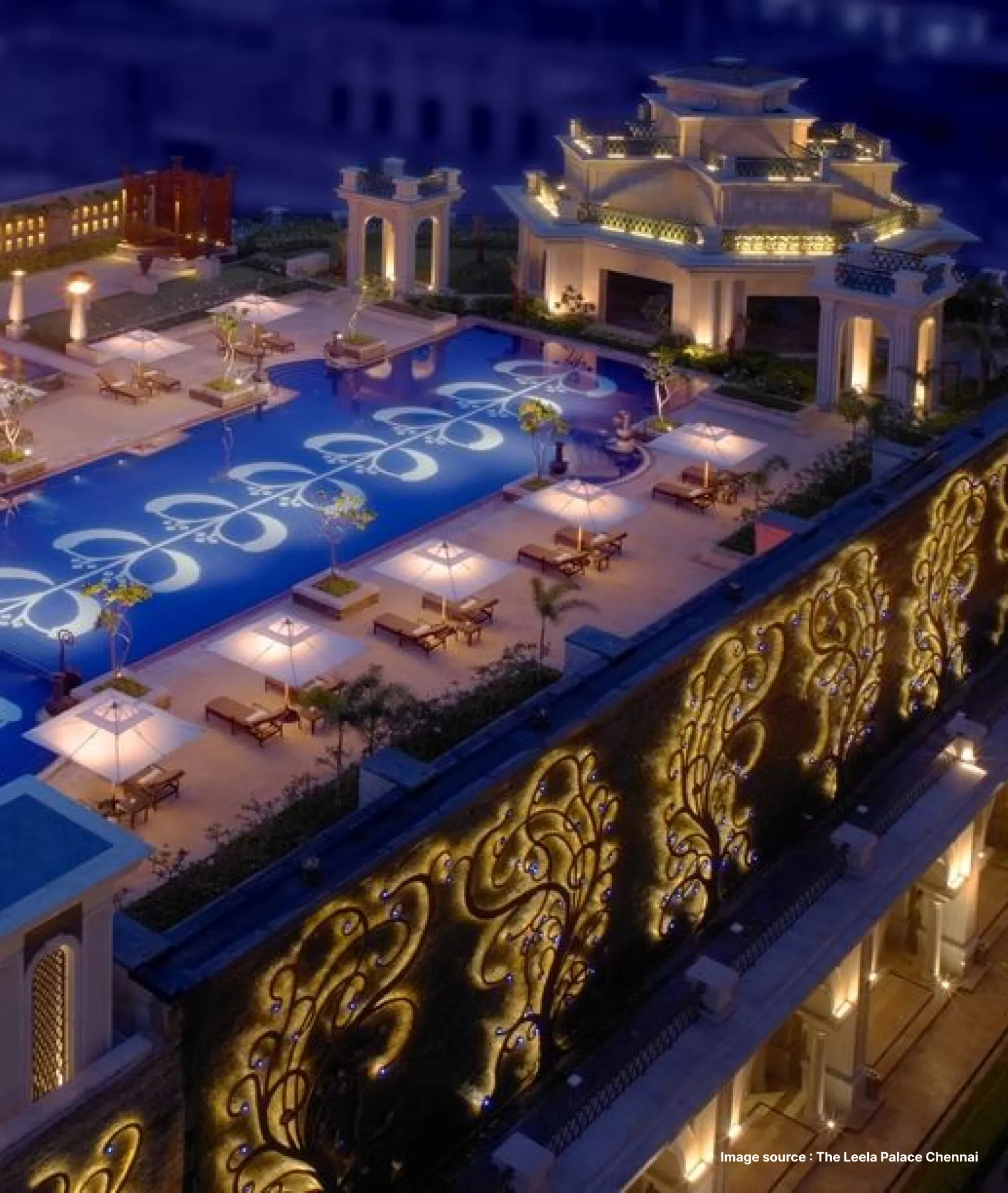 pool area of the leela palace in chennai with private decorated pavilions