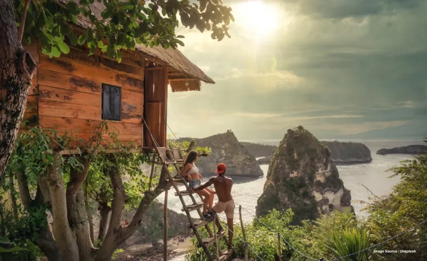 a picture of a couple climbing a tree house