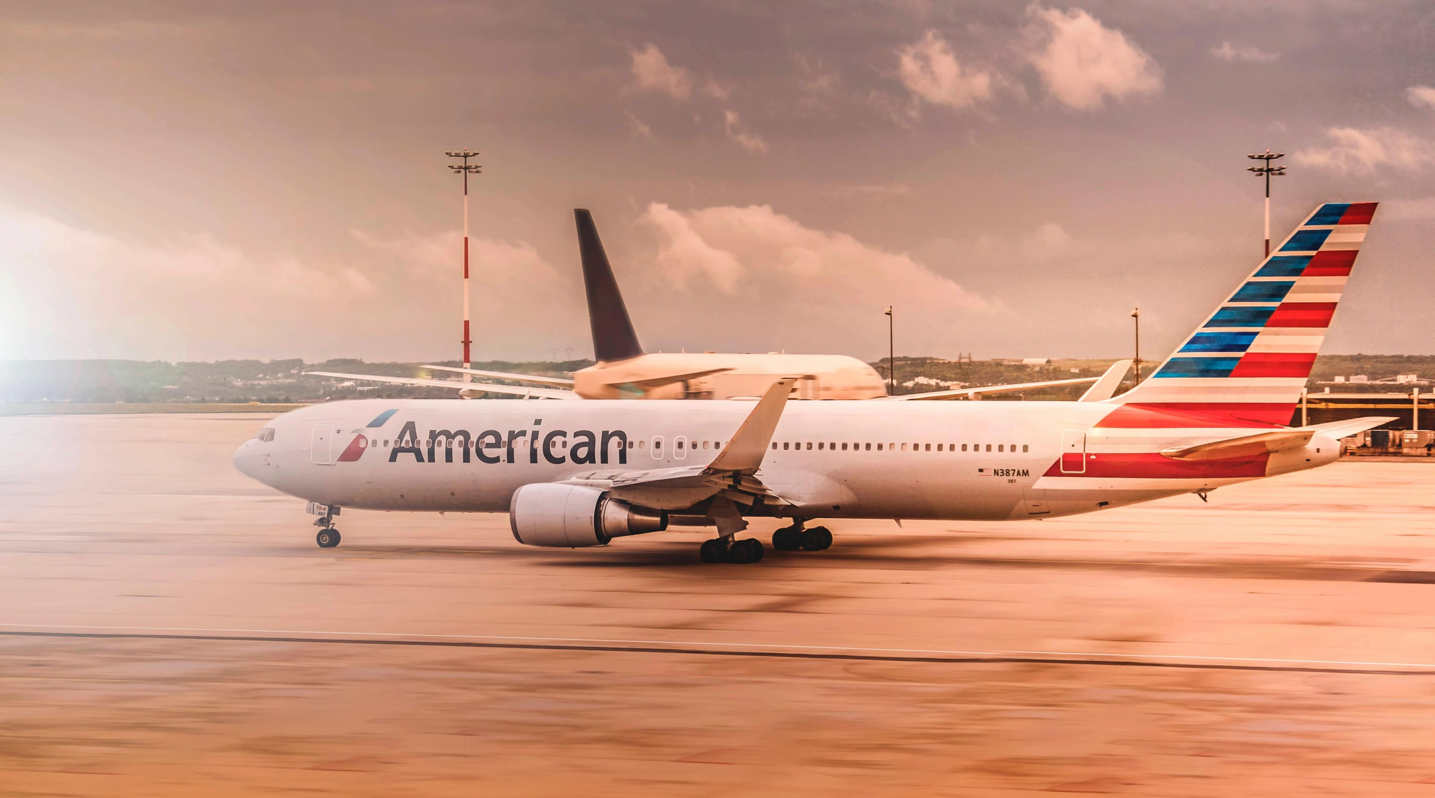 an american airline plane waiting on the runway