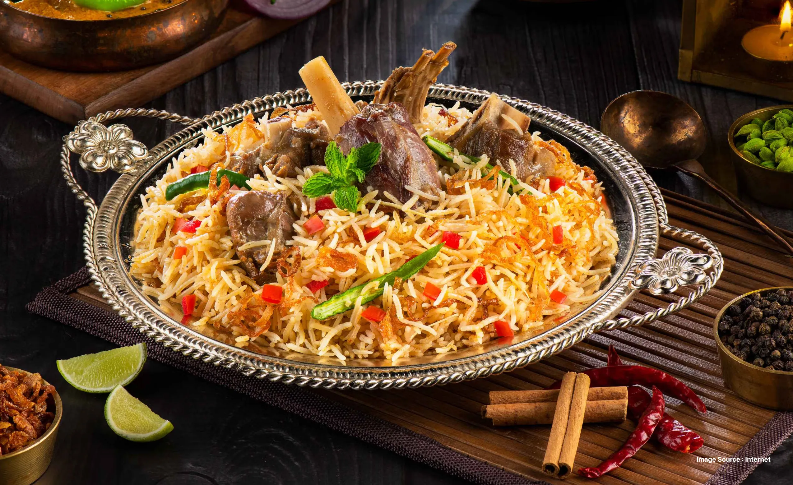 a gorgeous serving of chicken biryani, an indian dish with aromatic spices & colorful rice