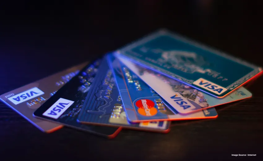 multiple credit cards laying spread out on a table