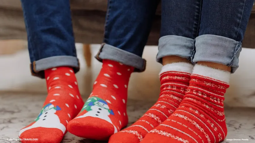 2 feet wearing christmas socks