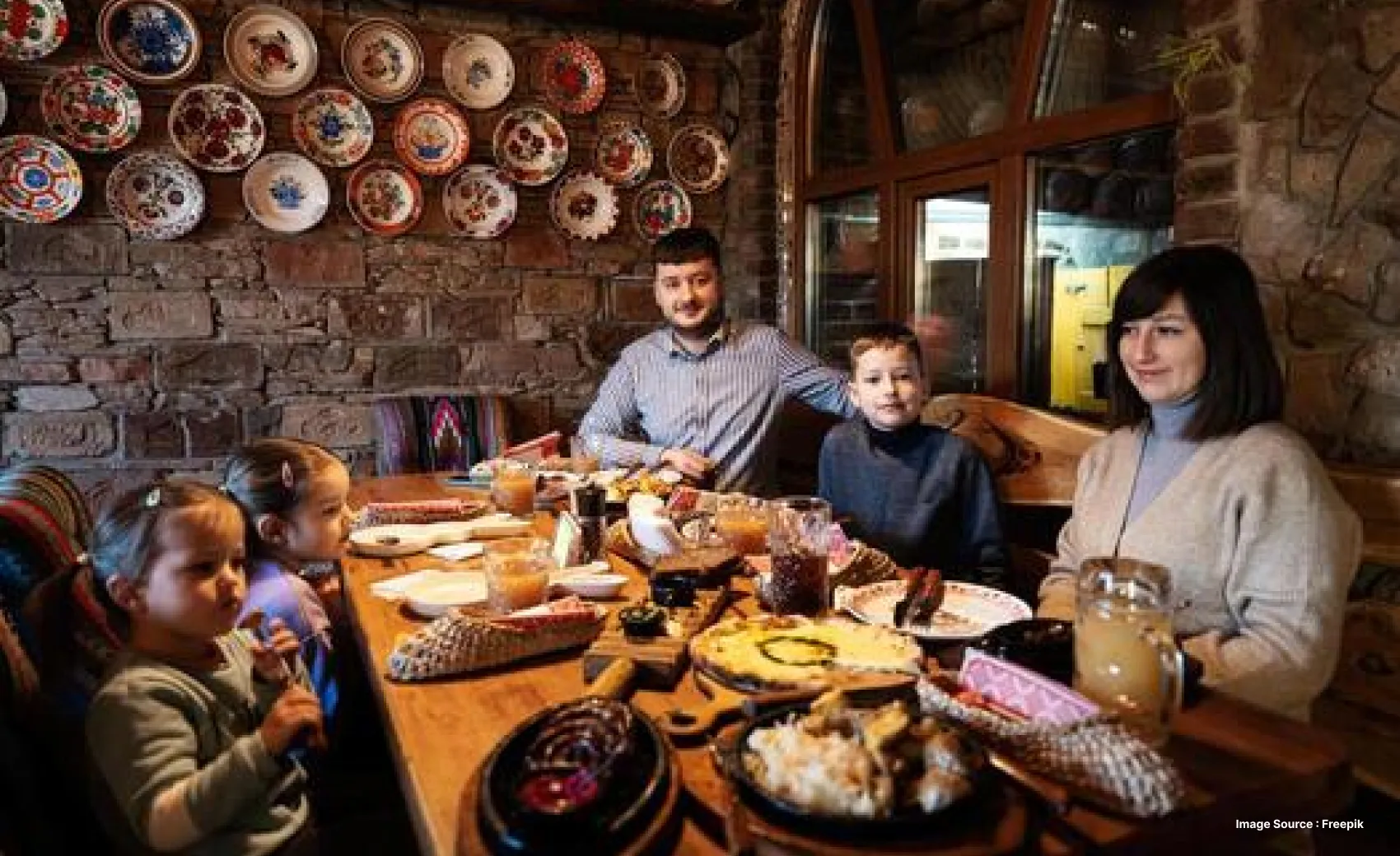 a family enjoying a dinner with an elaborate feast