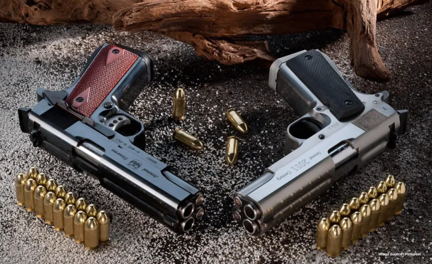 two guns kept on the floor with ammo laying beside them