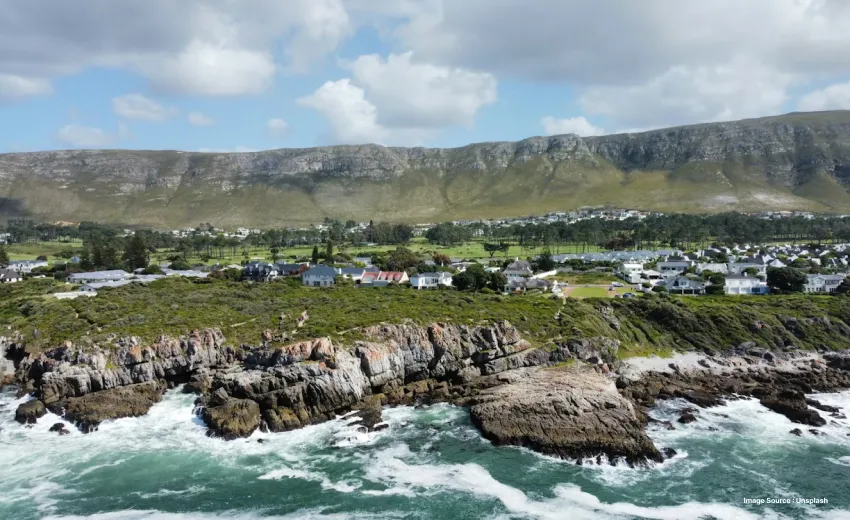 aerial shot of the dramatic small cliffs and green hills of hermanus