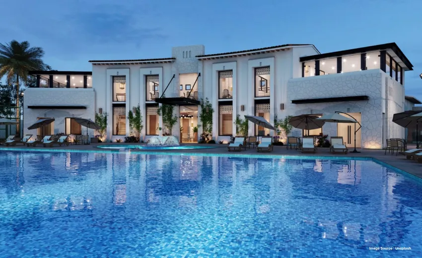 Luxury resort with swimming pool at dusk