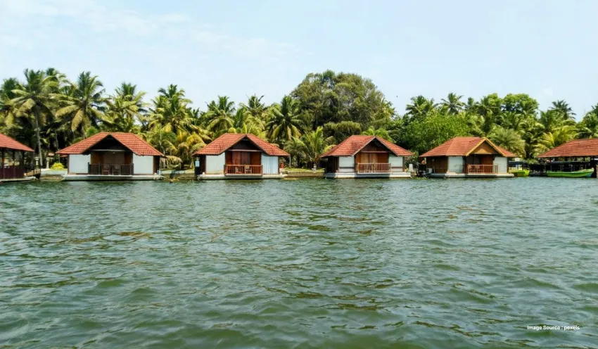 Scenic waterfront cottages surrounded by lush tropical palms
