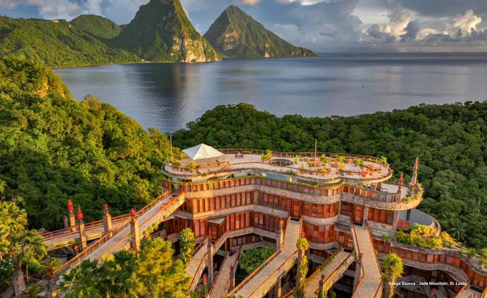 an enchanting wide angle view of the Jade Mountain resort with stunning views of the carribean sea & green mountains