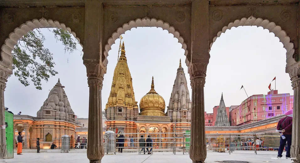 three indian style archways framing a golden architecture temple