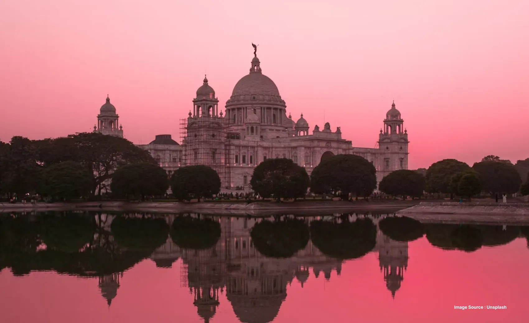 the beautiful white building of victorias memorial at sunset