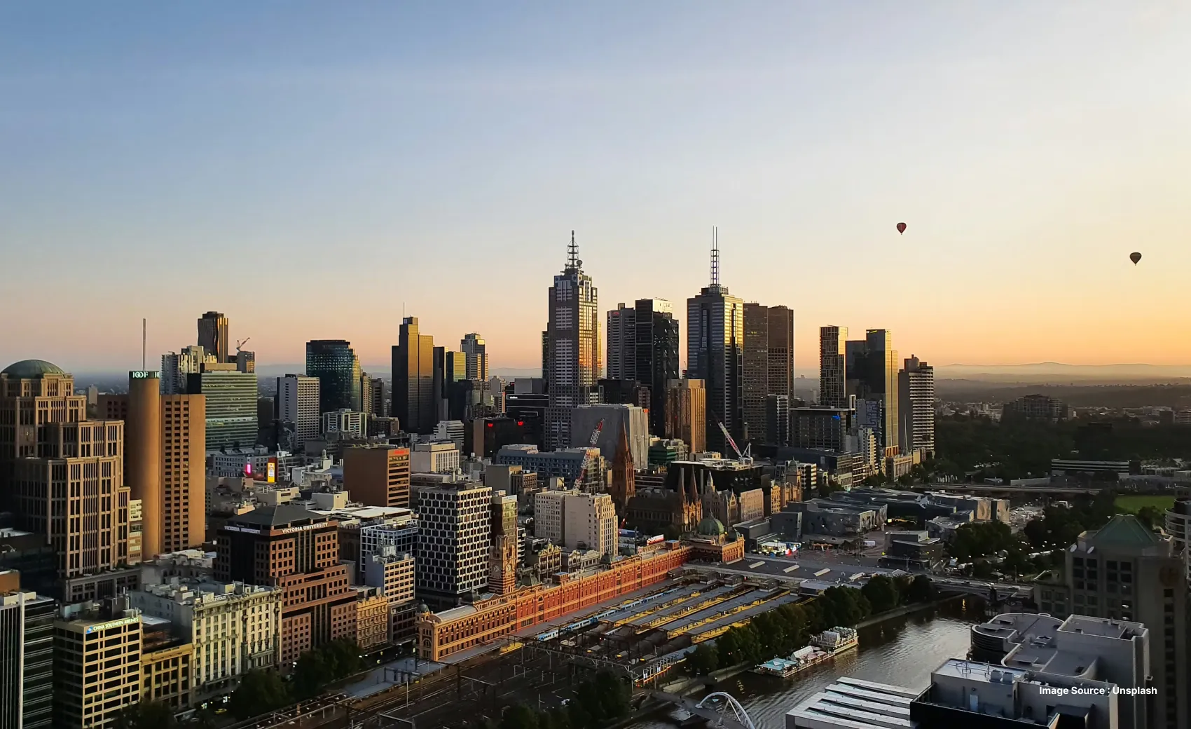 sunset view of the skyline of melbourne city with skyscrapers and tall towers