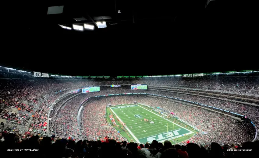 An image of metlife stadium from an overhead view with the crowd watching the players on the field.