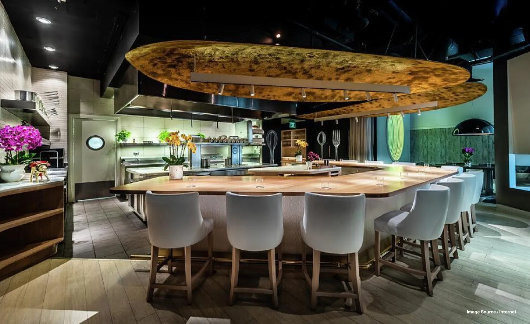 the gourmet dine-in restaurant of chef jose with white furniture and upscale atmosphere