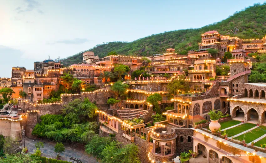 evening view of the lit up neemrana fort hotel 