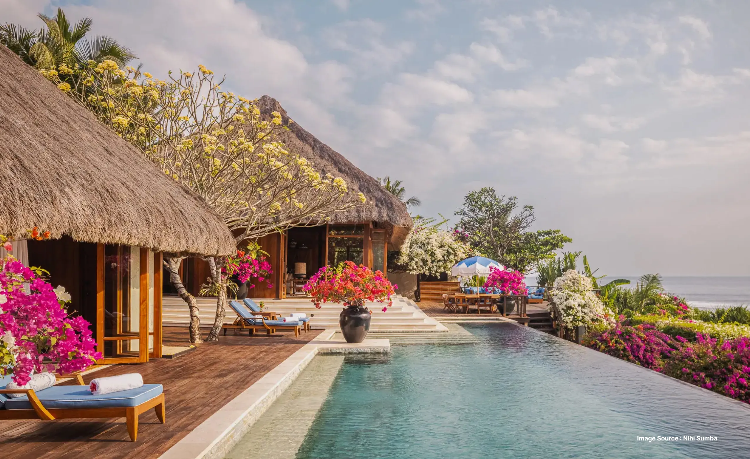 A view from a balcony of  a luxury room of Nihi Sumba resort, with private swimming pool and a view of tropical forest of indonesia 
