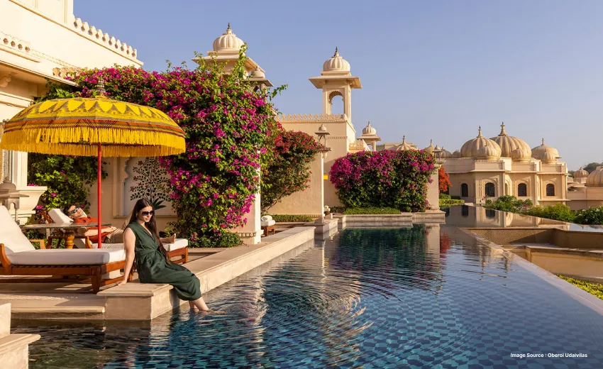 Luxury infinity pool overlooking royal palace architecture