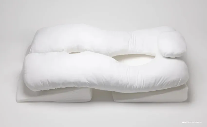 minimalist white bedding setup with a duvet on a modern bed